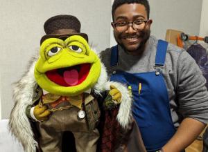 Man holding a puppet 